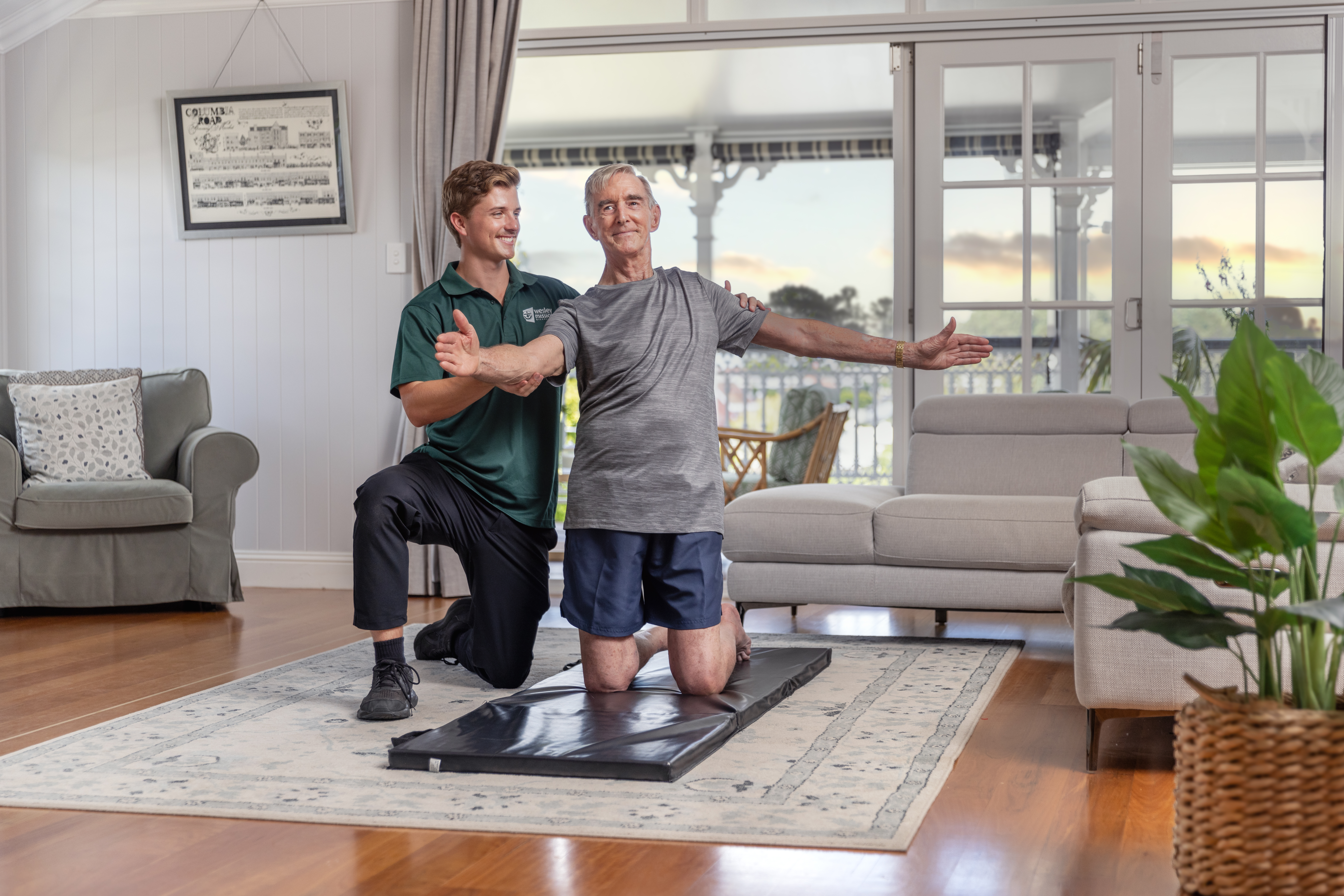 Young WMQ physio conducting an at-home session with a senior patient in South East Queensland