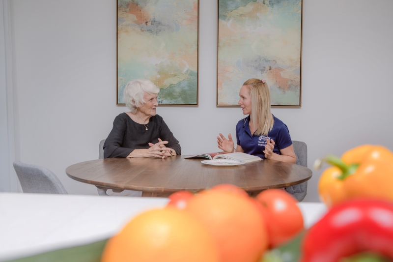 Dietician and senior client during an at-home dietetics appointments