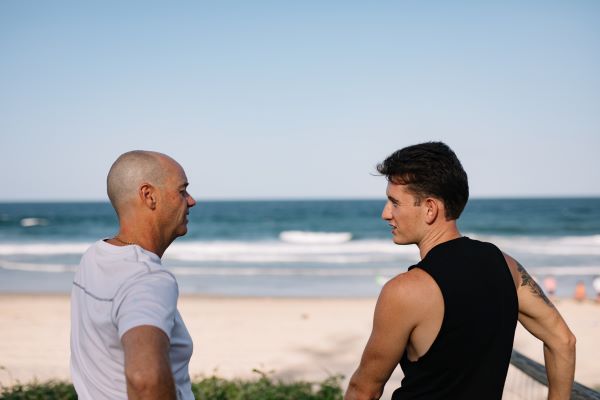 Two men talking at the beach a spart of Marcus Mission, one of our suicide prevention initiatives