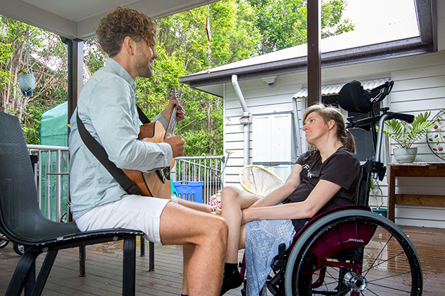 Residents at our specialist disability accommodation can enjoy ourdoor activities like music in the varanda at WesleyCare Tewantin