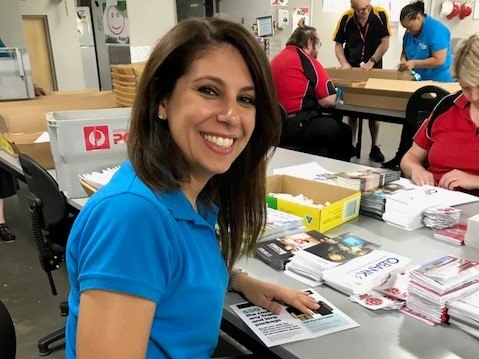 Lady sitting at desk smiling