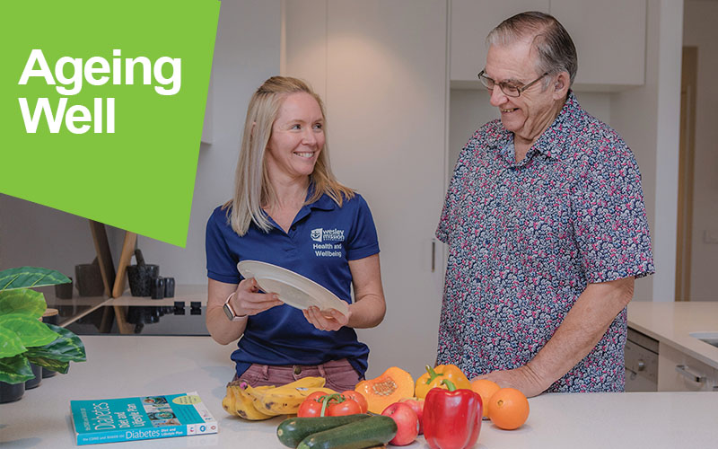 Aged care worker helping a retiree prep food and cook meals.