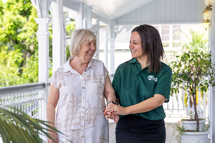 Home Care Brisbane - Staff anf client chating outdoors - WMQ Home Care Brisbane - Staff and retiree chatting outdoors