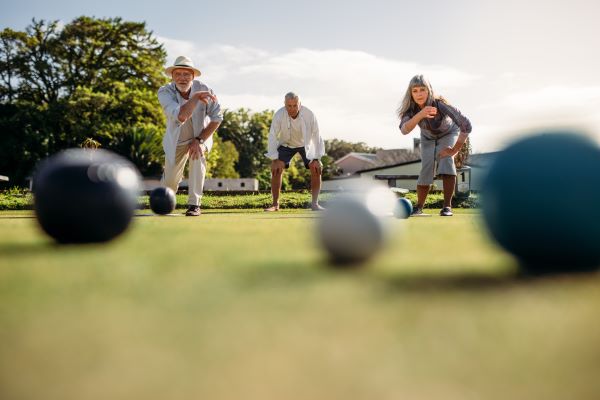 Active ageing with Wesley Mission Queensland Home Care People playing lawn bowls outside