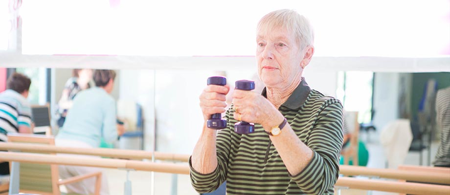 Aged care resident working out in gym