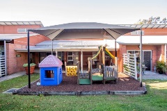 Shaded play equipment area for grandchildren's visits