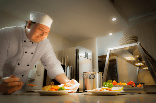 A chef preparing meals for a Welsey Mission Queensland aged care home in Brisbane