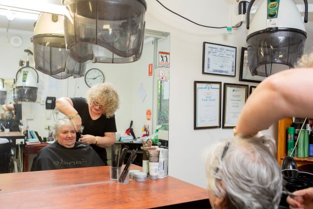 A resident getting her hair cut at an Onsite hairdressing salon