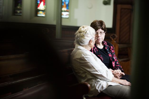 Pastoral carer listens to a resident from a Wesley Mission Queensland RAC community