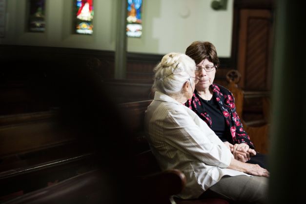 Spiritual care Pastoral carer listens to a resident from a Wesley Mission Queensland RAC community