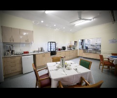 Kitchen overlooking dining tables