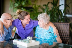 Residents enjoying a game with a staff member