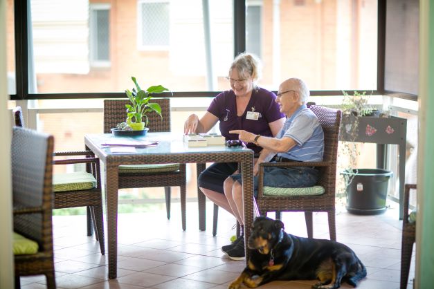 Resident, staff and dog at St Marks