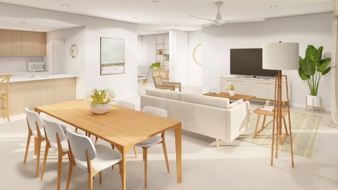 Dining table and chairs in foreground with living area and kitchen in background