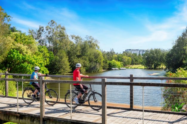 Residents enjoying active retirement cycling in Sinnamon Park