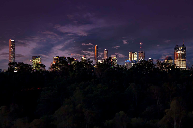 Rosemount Retirment Village - Night view of Brisbane City behind village trees