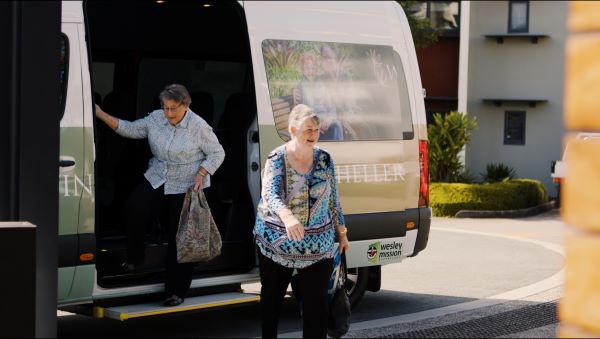 Residents with shopping bags are dropped home by bus to Wheller on the Park