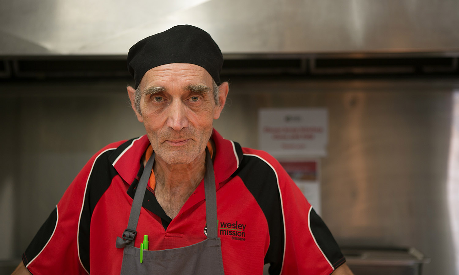 man in apron and cook's hat